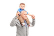 Senior giving a piggy back ride to his grandson