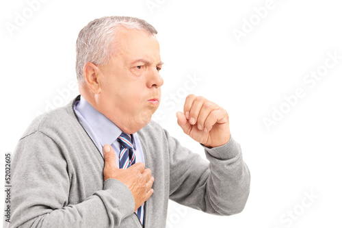 Photo: A mature gentleman coughing because of pulmonary disease A mature gentleman coughing because of pulmonary disease
