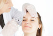 Photo: Young woman getting botox in her frown Young woman getting botox in her frown