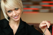 Foto: Young blond woman with a gentle smile Young blond woman with a gentle smile