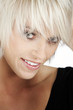 Foto: Smiling young blond with a trendy modern hairstyle Smiling young blond with a trendy modern hairstyle