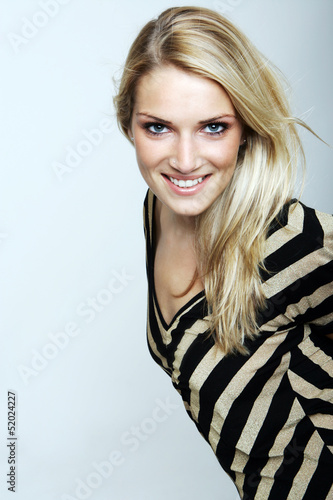 Photo: Smiling blond woman in a striped top Smiling blond woman in a striped top