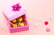 Chocolates in cute gift box with colorful hearts