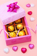 Chocolates in cute gift box with colorful hearts