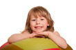 Smiling pretty child with fitness ball. Isolated on white