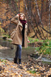 Foto: Young blond woman in autumn forest Young blond woman in autumn forest