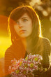 Photo: Sad young woman with a flowers Sad young woman with a flowers