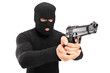 A thief with robbery mask holding a gun