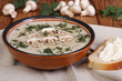 mushroom cream soup with mushrooms and milk cream with herbs