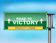 Highway sign with "Road to Victory" text