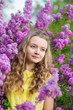 Photo : Spring portrait of a beautiful girl with lilac Spring portrait of a beautiful girl with lilac