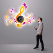 young man singing and listening to music with musical notes