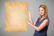 Young girl presenting old paper copy space