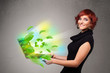 Photo: Casual woman holding notebook with recycle and environmental sym Casual woman holding notebook with recycle and environmental sym