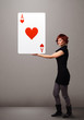 Foto: Beautifu woman holding a red heart ace Beautifu woman holding a red heart ace
