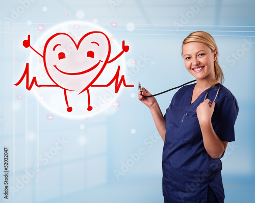 Photo: Attractive doctor with happy red smiling heart Attractive doctor with happy red smiling heart
