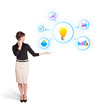 Young woman presenting light bulb with colorful graphs and diagr
