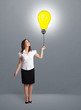 Pretty lady holding a light bulb balloon