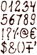 Numbers and symbols set written with chocolate syrup