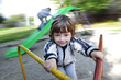 Photo: happy boy on carousel outdoors happy boy on carousel outdoors