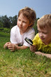 Photo: boys with magnifying glass outdoors boys with magnifying glass outdoors