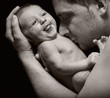 Photo: Father and his newborn baby. Father and his newborn baby.