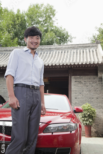 Photo: Young Businessman with His Car Young Businessman with His Car