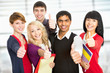 Students giving the thumbs-up sign