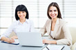 Young business woman using laptop
