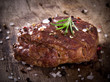 Delicious beef steak on wooden table