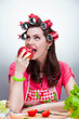a girl eats an Apple