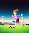 A girl playing football at the field