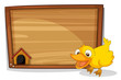 A duck beside an empty wooden board