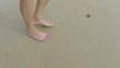 1920x1080 video - Human legs walking on the sand beach