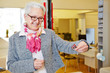 Elderly woman comparing glasses