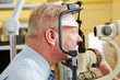 Man at eye measurement at ophthalmologist