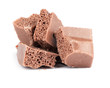 Porous chocolate isolated on white background