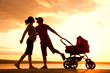 Photo: happy family walking on sunset happy family walking on sunset