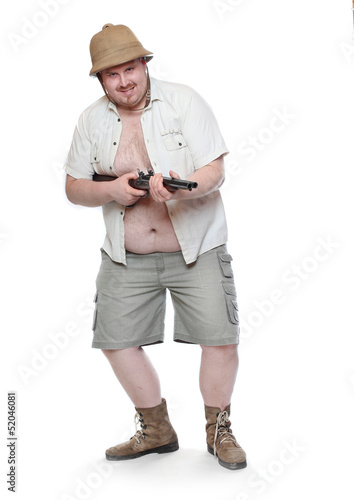 Photo: Funny obese hunter aiming with shotgun. Funny obese hunter aiming with shotgun.