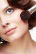 Foto: woman with makeup brush woman with makeup brush