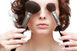 Foto: woman with makeup brush woman with makeup brush