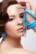 woman with teal beads