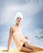 Photo: Young attractive woman in towel making the spa treatment Young attractive woman in towel making the spa treatment