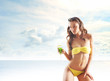 Photo: Young sexy brunette in yellow swimsuit Young sexy brunette in yellow swimsuit