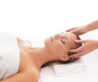 Young attractive woman getting massaging treatment