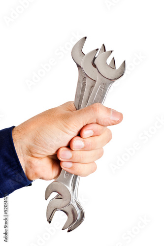 Photo: Hand holding wrenches Hand holding wrenches