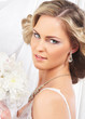 Young, beautiful and emotional bride with a beautiful flowers