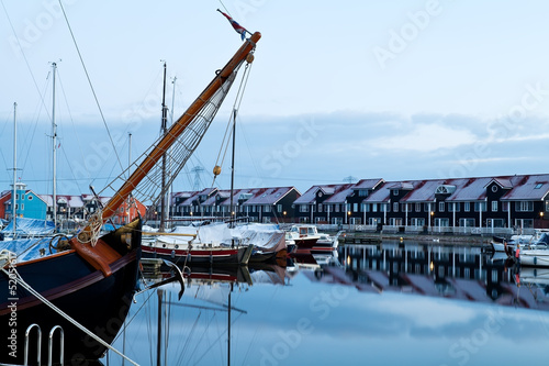 Photo: ship and yacht at marina before sunrise ship and yacht at marina before sunrise