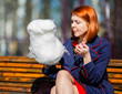 Woman eating cotton candy