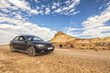 Car in Desert of the Bardenas Reales in Navarre